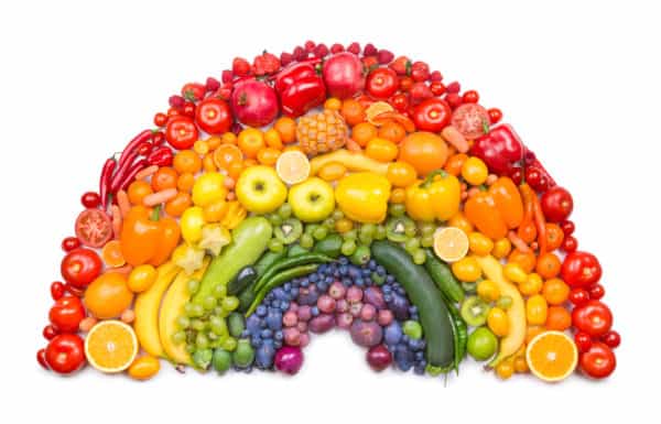 Fruit and vegetables arranged like a rainbow to show the different colours of fruit and vegetables.
