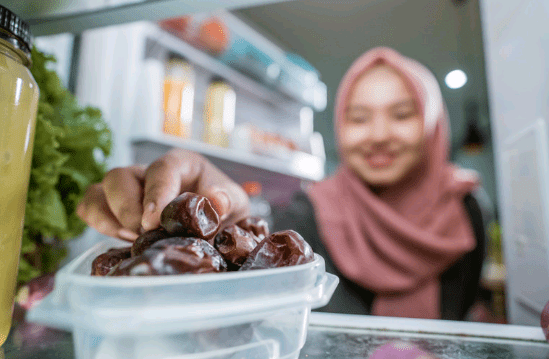 Muslim girl eating dates