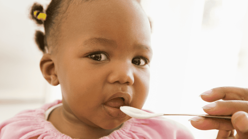 Baby Eating Smooth Foods off a spoon